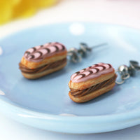 PolinaCreations Handmade jewelry Stuffed pink Eclair Stud Earrings with chocolate stripes Eclair earrings polina creations fake food jewelry miniature food jewelry mini food earrings cute earrings cute jewelry dessert jewelry hypoallergenic earrings pink earrings pink jewelry chocolate jewelry chocolate earrings gift for her gift for girl woman pastry earrings pastry charm pastry jewelry food charm pink eclair earrings pink glaze with chocolate stripes