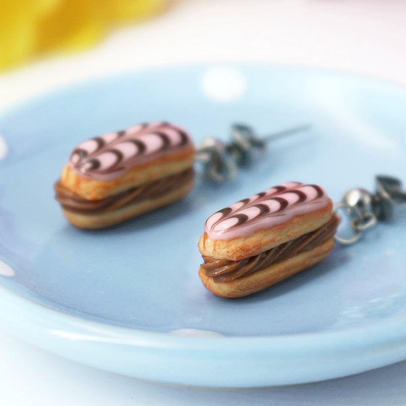 products/handmade_polymer_clay_stuffed_eclair_stud_earrings_with_chocolate_whipped_cream_crop.jpg